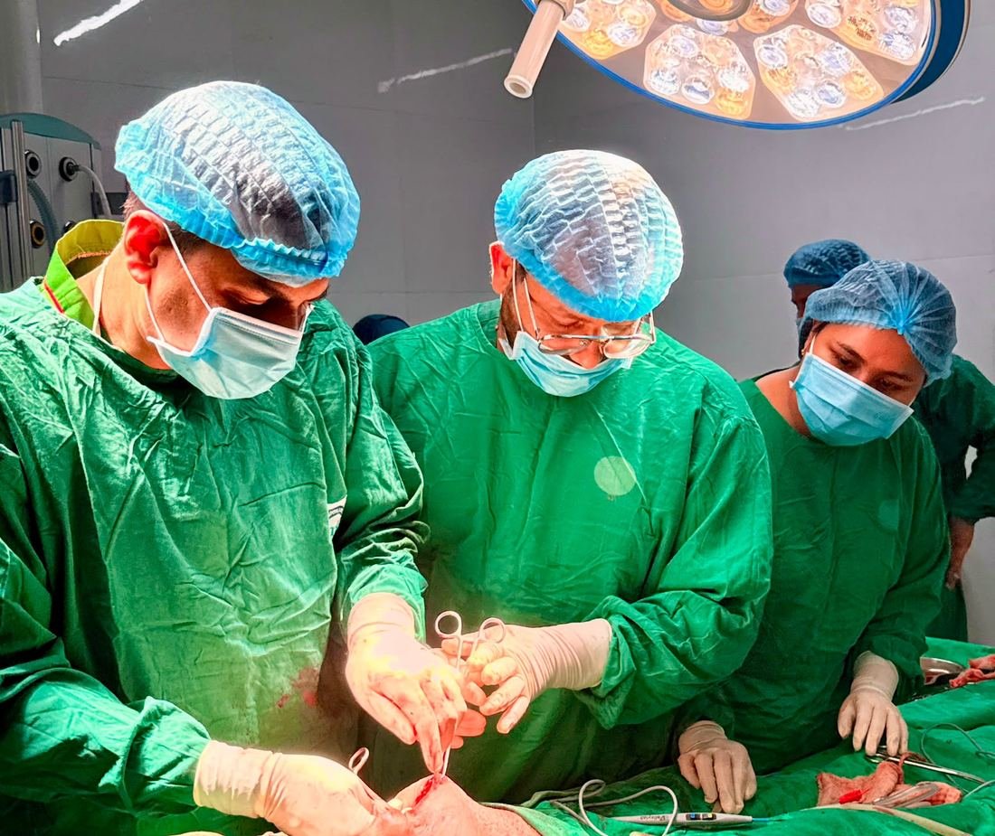 Dr. Maksudur Rahman leading a surgical team in theatre